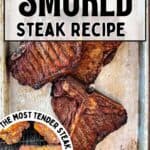 Three smoked T-bone steaks on a serving tray.
