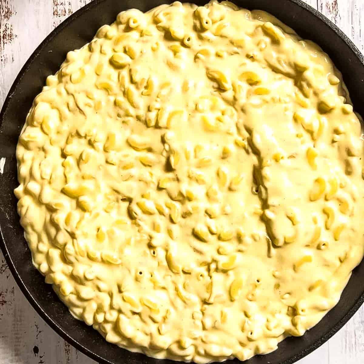 The macaroni and cheese transferred to a large cast iron skillet.
