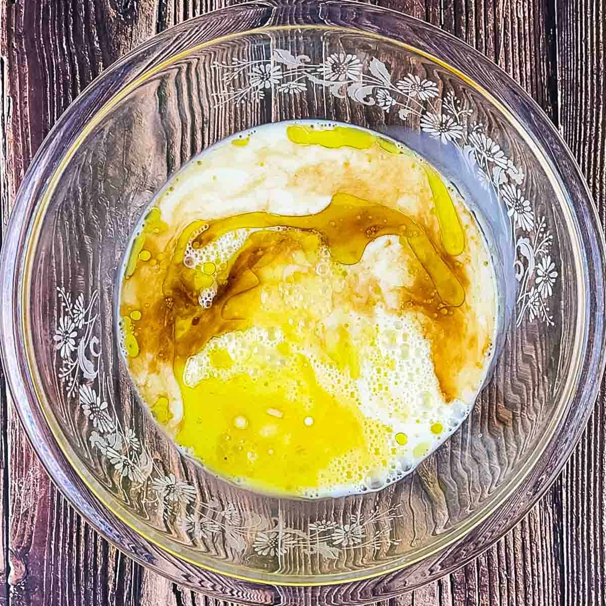 The rest of the liquid ingredients added to the mixing bowl with the eggs.