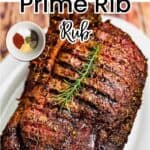 A smoked prime rib roast on a serving platter, with an inset picture of the prime rib rub ingredients in a small bowl.