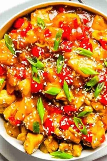 Pineapple chicken stir fry with tender chicken and juicy pineapple in a savory-sweet sauce.