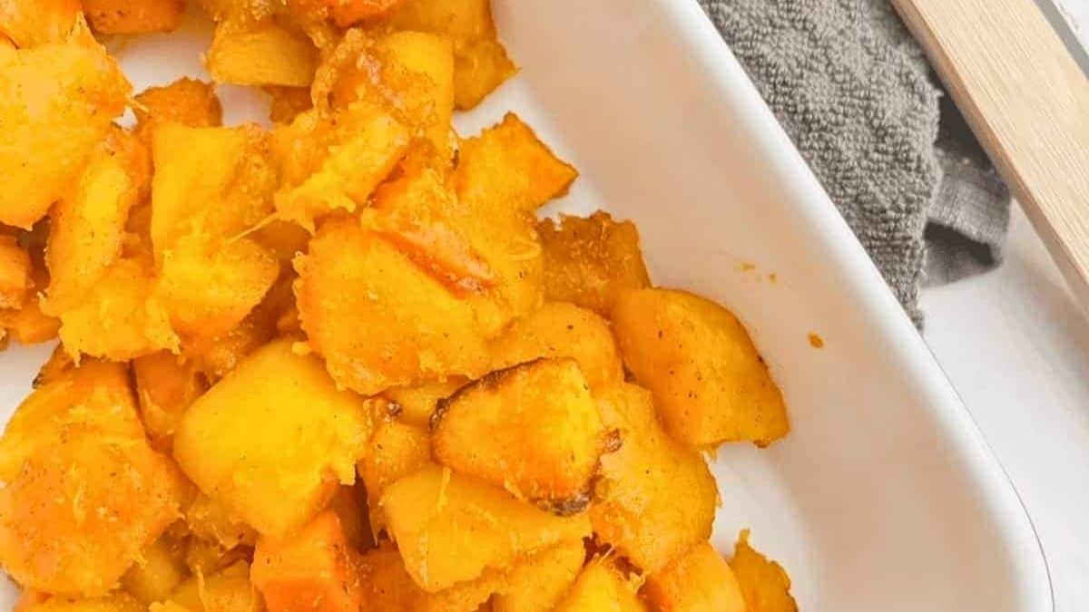 Oven roasted squash and sweet potato in a baking dish.