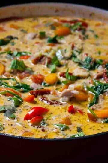 A pot filled with creamy marry me chicken soup ready to be served.