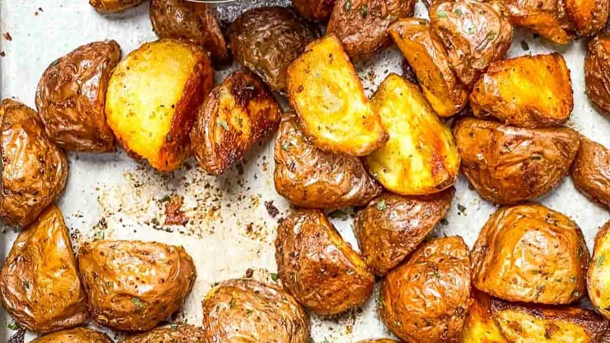 Golden brown, perfectly crispy roasted potatoes with herbs.