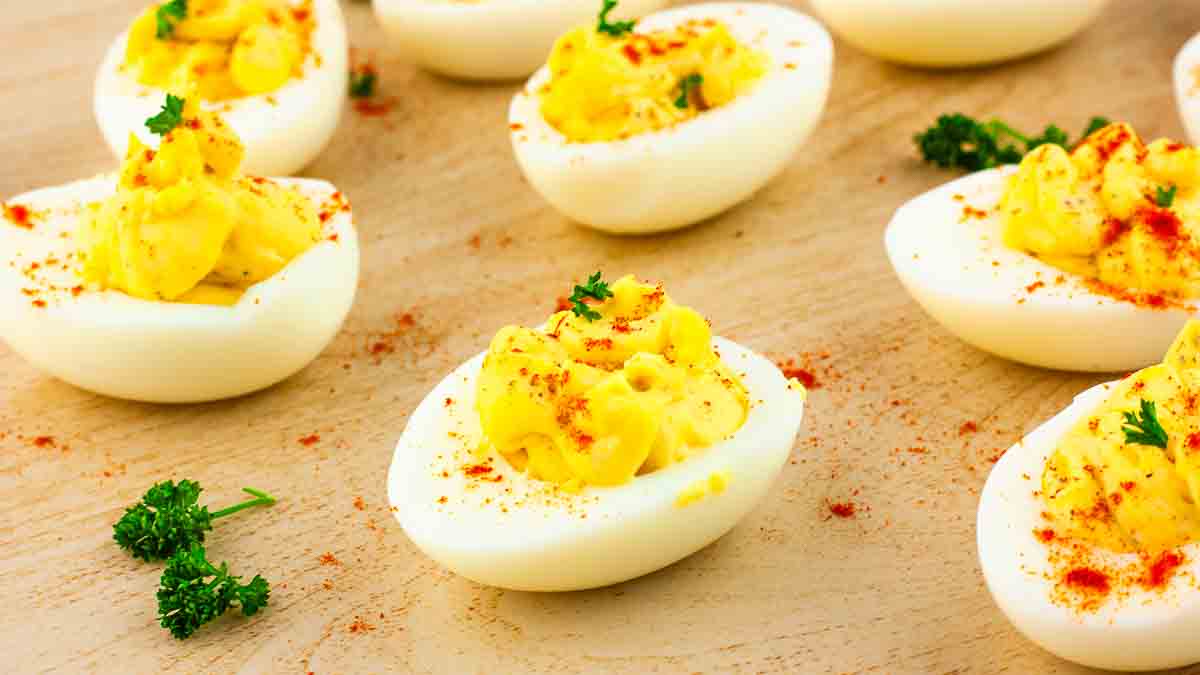 Creamy classic deviled eggs on a serving tray.