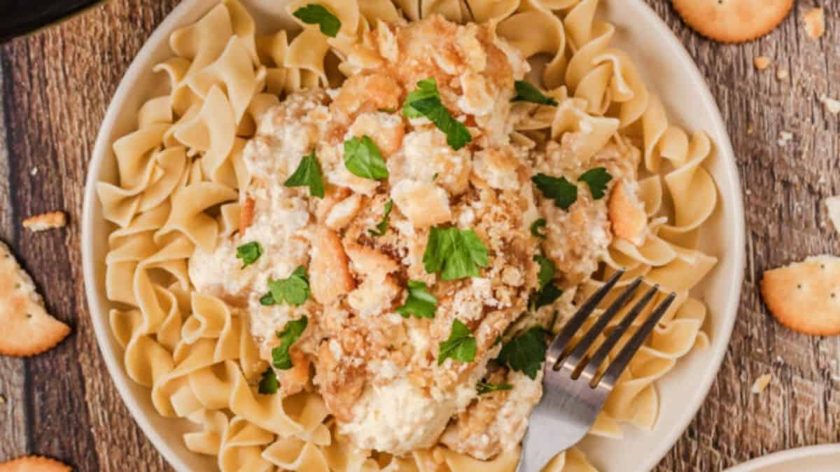 Tender chicken breasts coated in golden, crushed Ritz crackers and smothered in a creamy sauce.