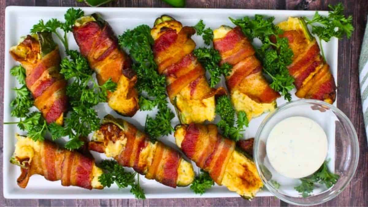 Spicy jalapeños stuffed with Boursin, wrapped in crispy bacon.