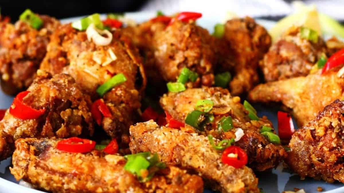 Crispy wings tossed with chili flakes and green onions.