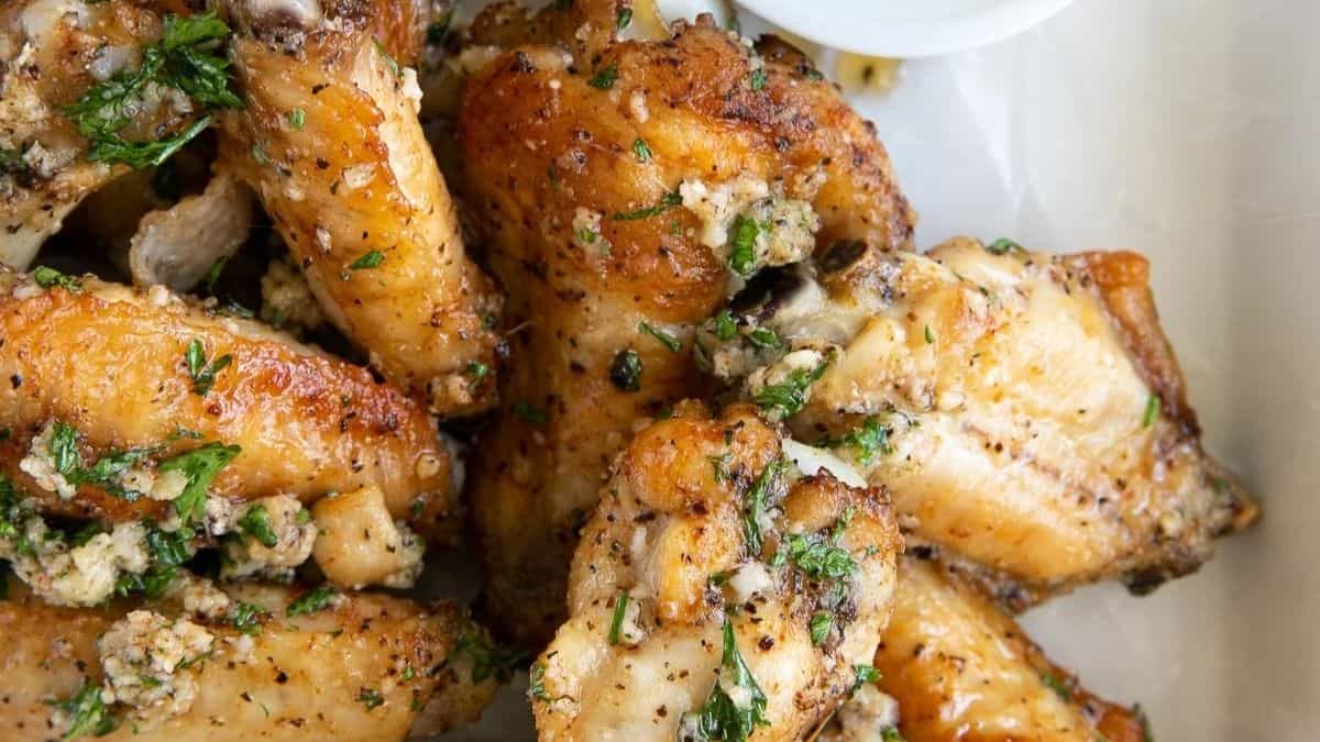 White wings coated in garlic, herbs, and grated Parmesan cheese.
