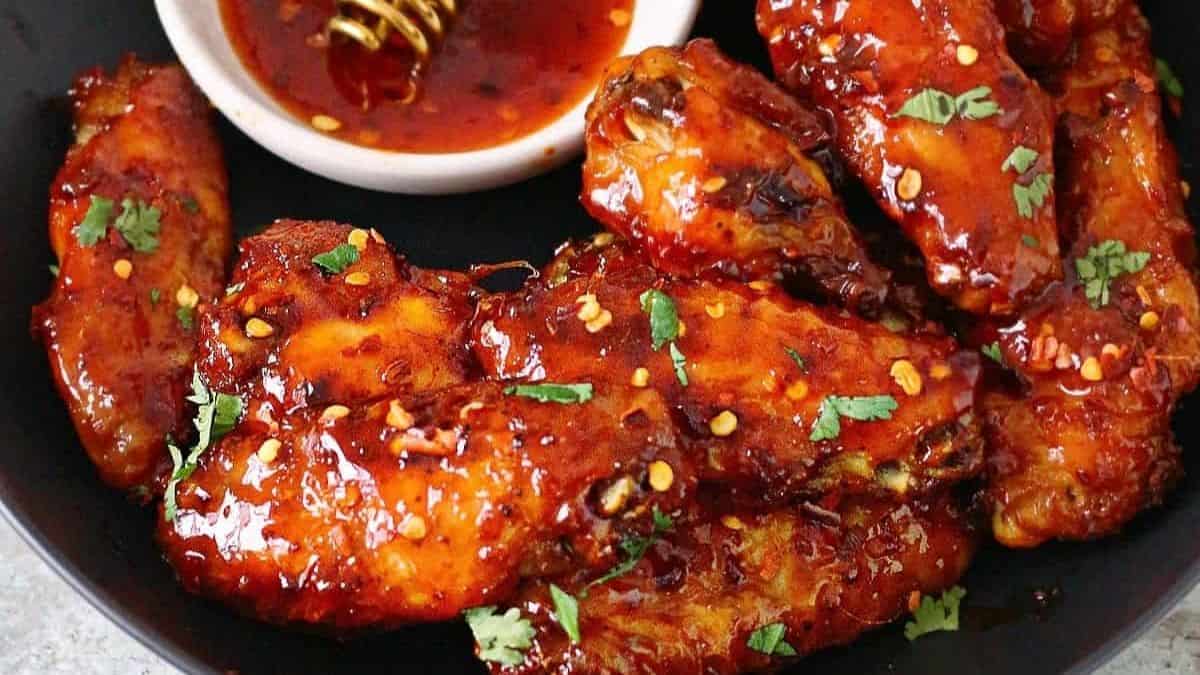 Golden brown wings drizzled with amber honey and sprinkled with herbs.