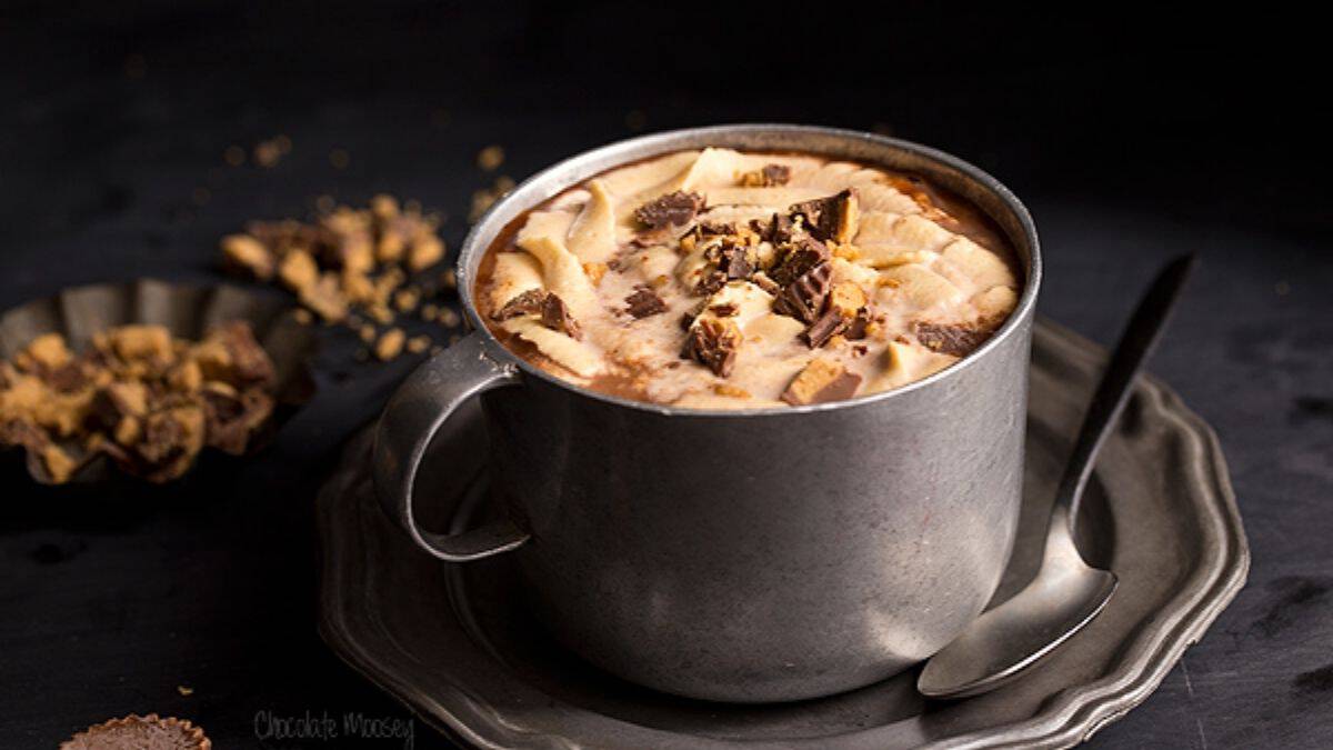 Hot chocolate with peanut butter swirl and chocolate peanut butter cups on top.