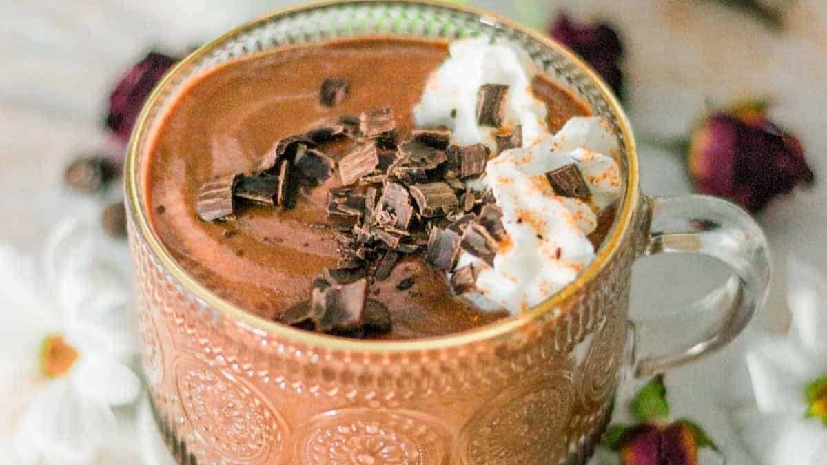 Hot chocolate dusted with cinnamon and cayenne and crushed dark chocolate.