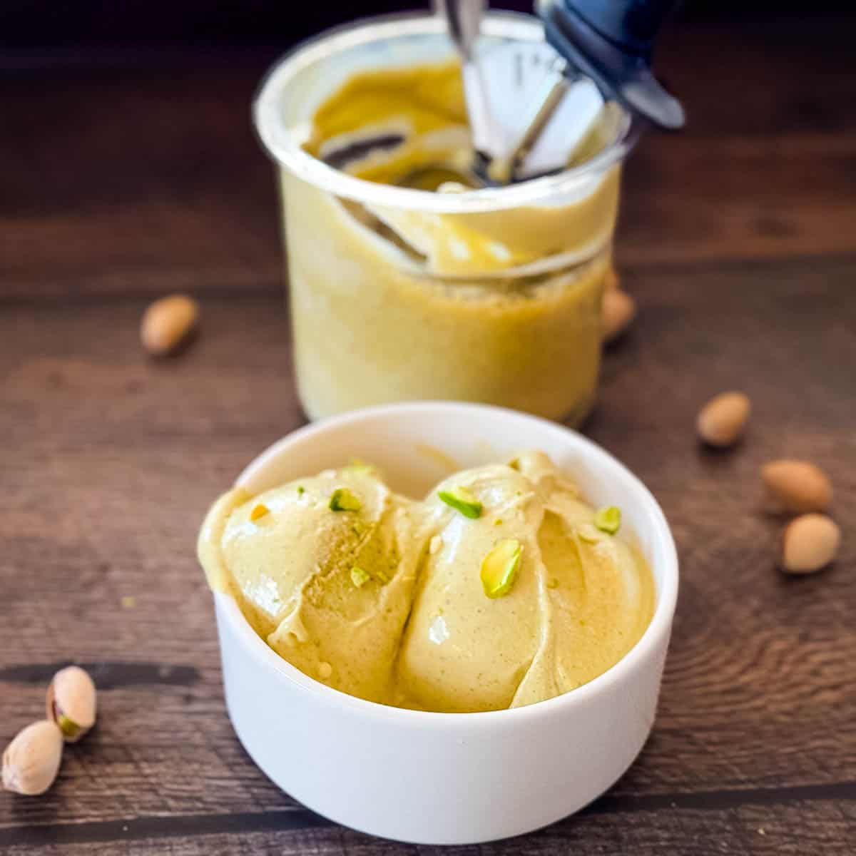 Finished Ninja Creami pistachio ice cream topped with chopped pistachios in a small bowl.