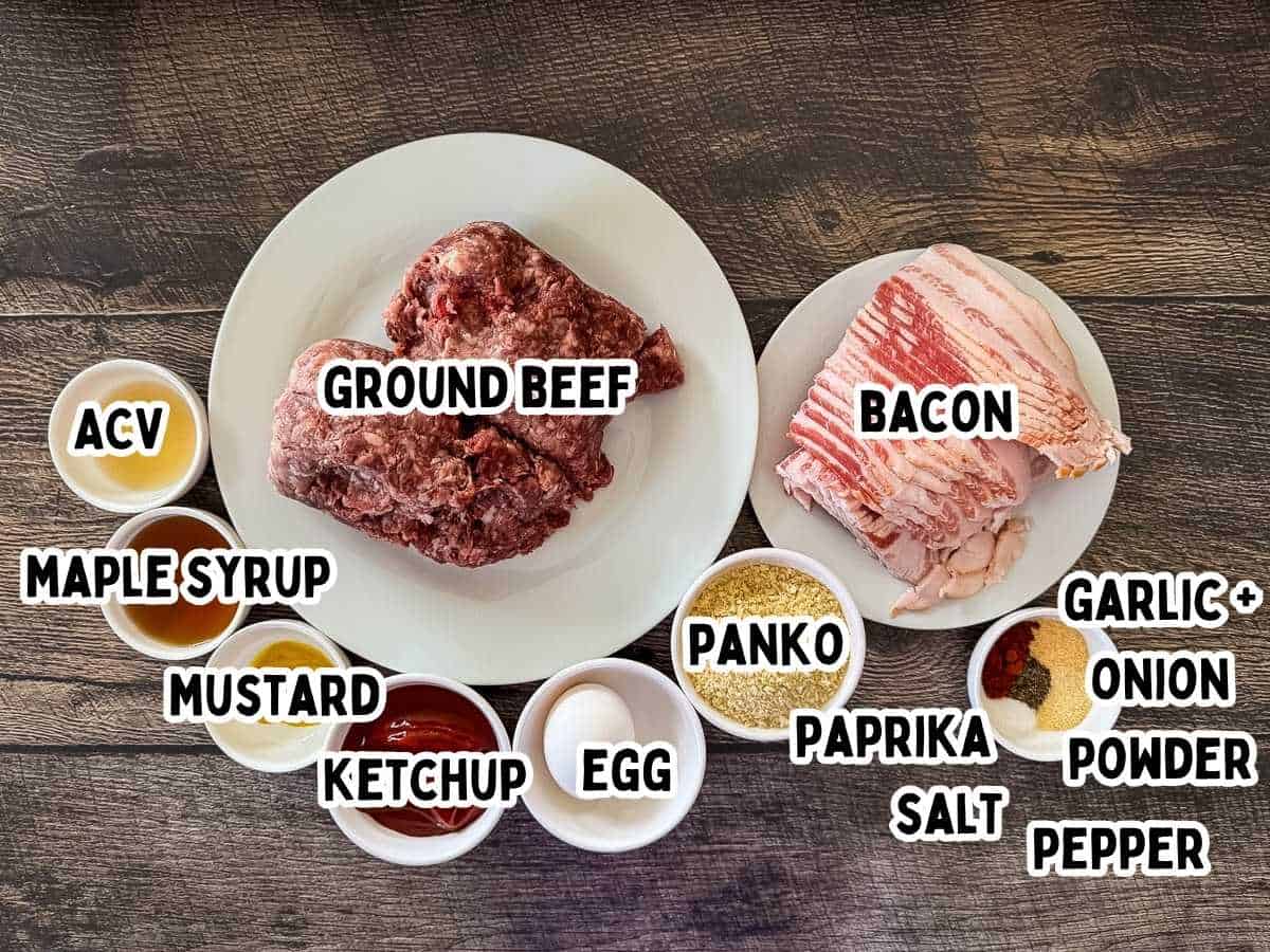 Ingredients for smoked bacon wrapped meatballs labeled and placed on a wooden table.