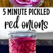A glass jar filled with thinly sliced bright pink pickled red onions, sitting on a wooden board.