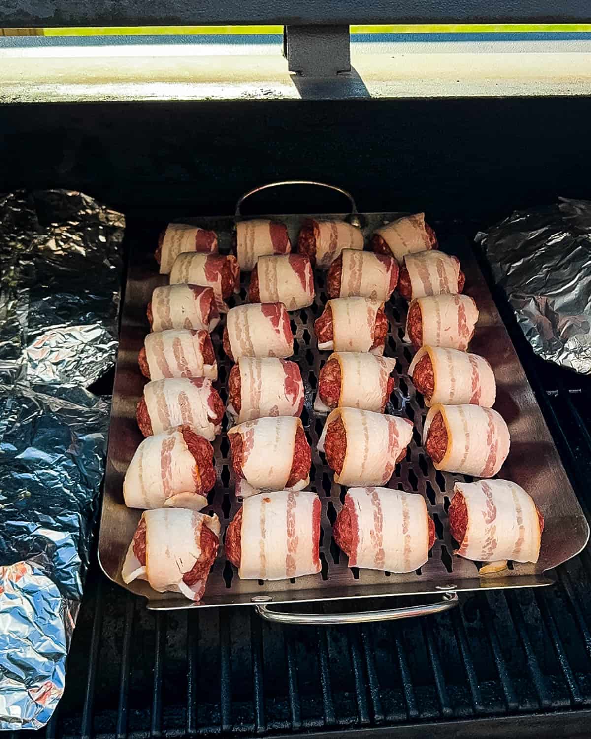 The bacon wrapped meatballs on the pellet grill.