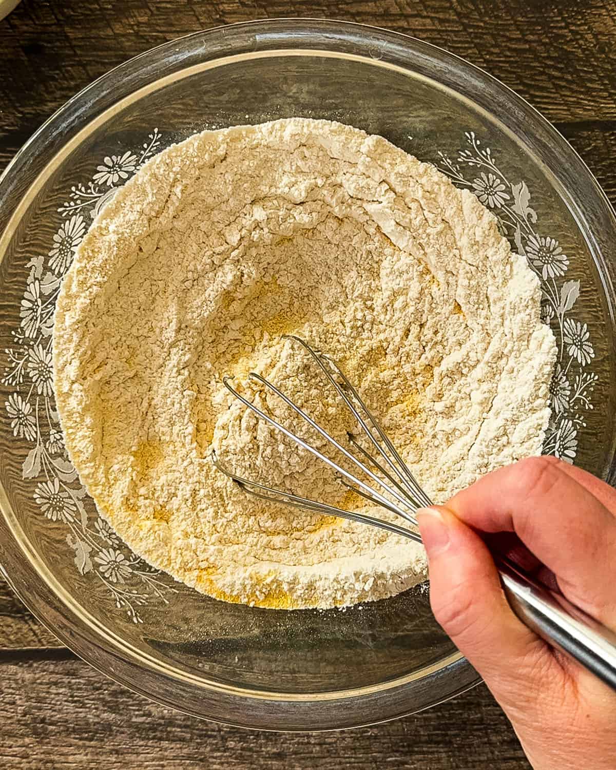 Dry ingredients for smoked cornbread being mixed in large bowl