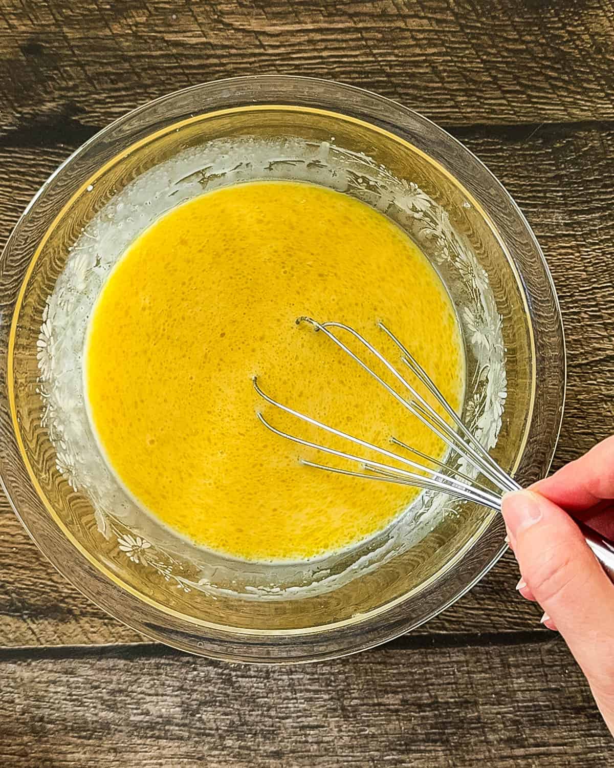 Wet ingredients whisked together in separate glass bowl.