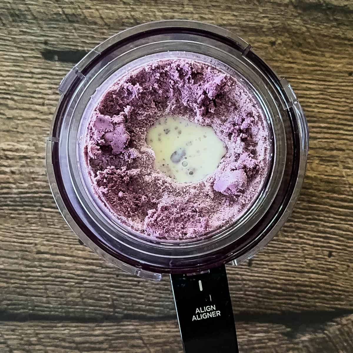 Crumbly blueberry cheesecake ice cream with a tablespoon of milk added to the center before the respin.