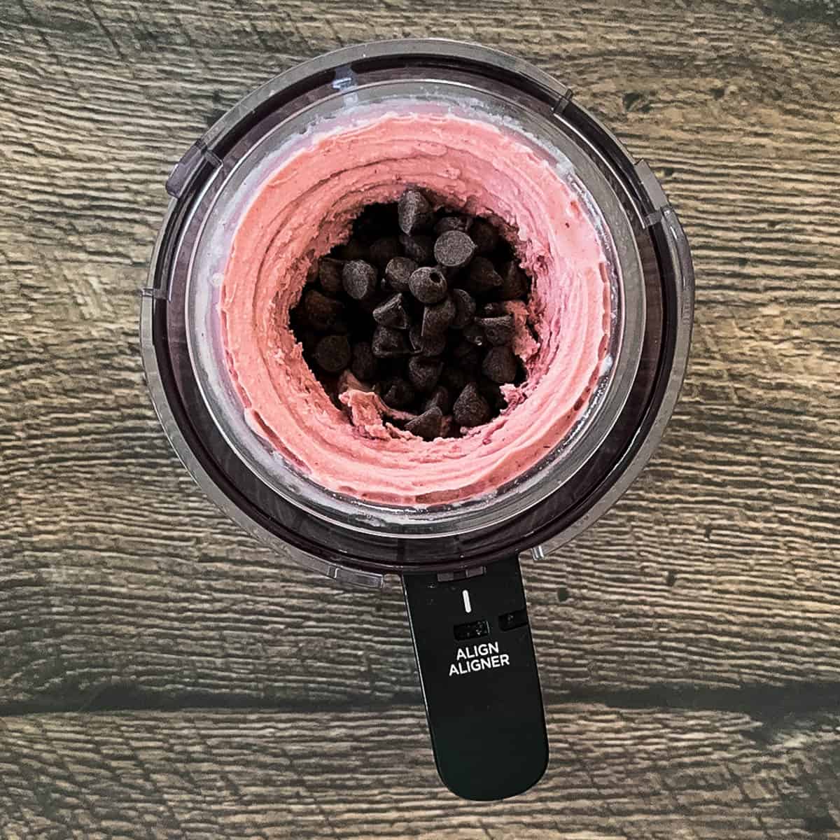 Chocolate chips added to a well in the center of the ice cream.