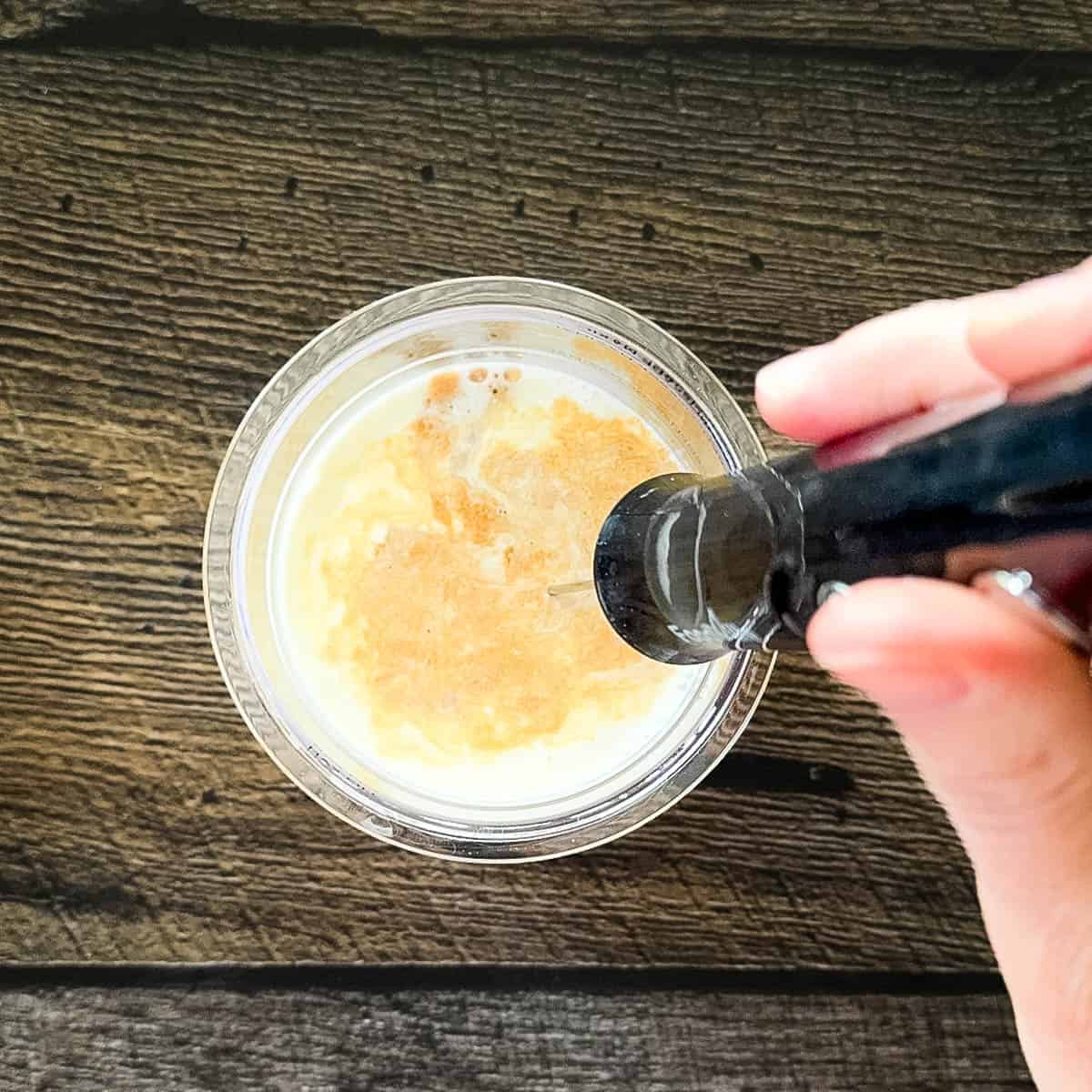 The maple walnut ice cream base whisked together in the pint container.