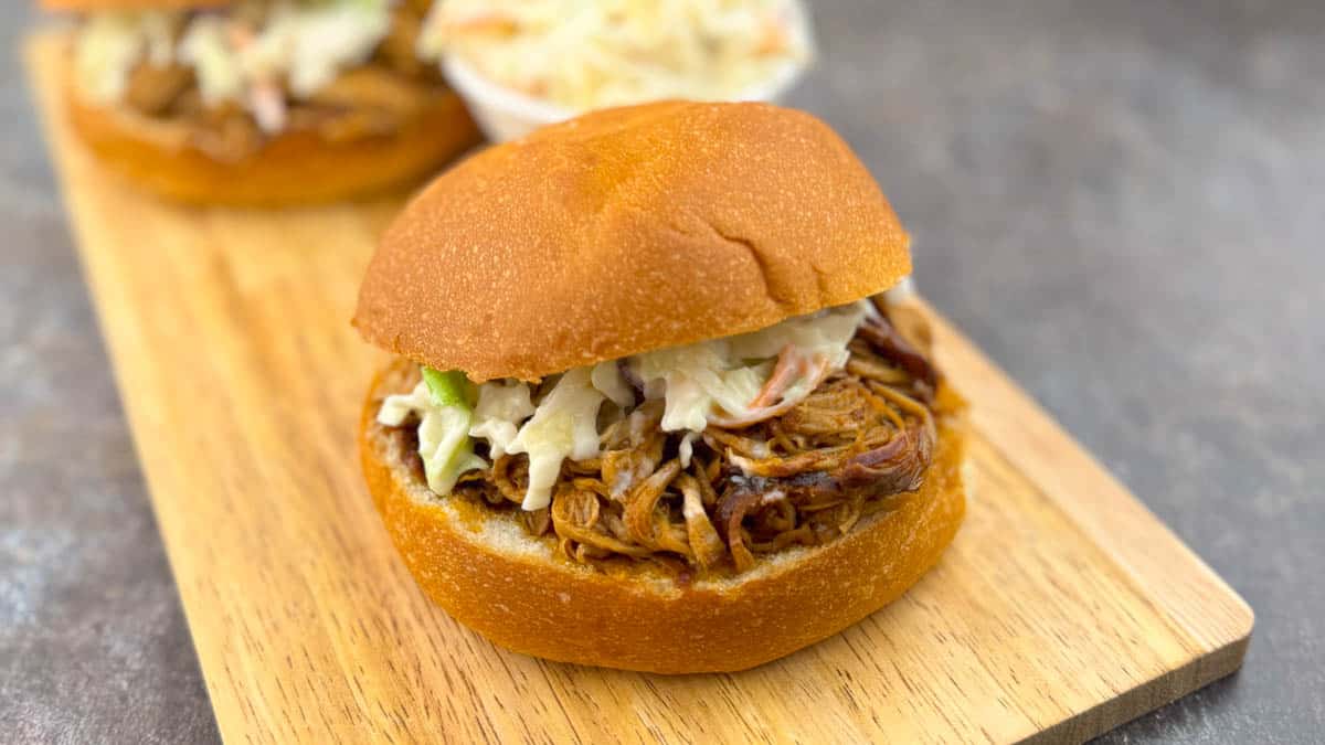 Juicy pulled pork bun topped with homemade coleslaw.