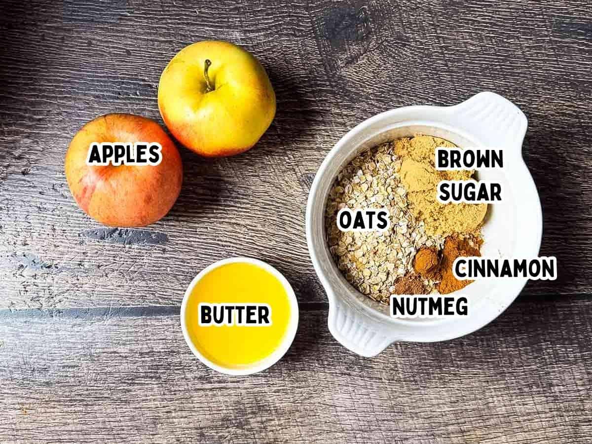 Labeled ingredients for baked apples in air fryer placed on a wooden table.