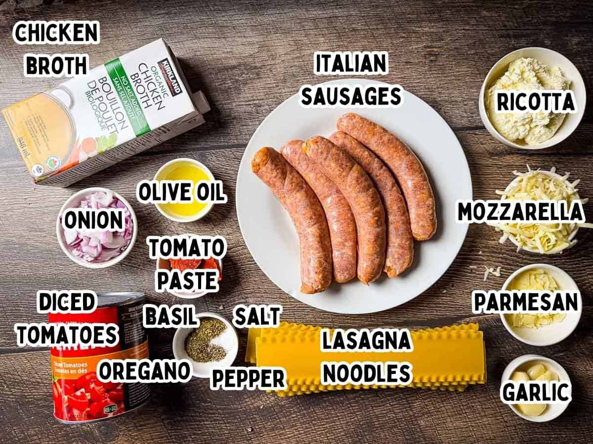 Labeled ingredients for one pot lasagna soup placed on a wooden table.