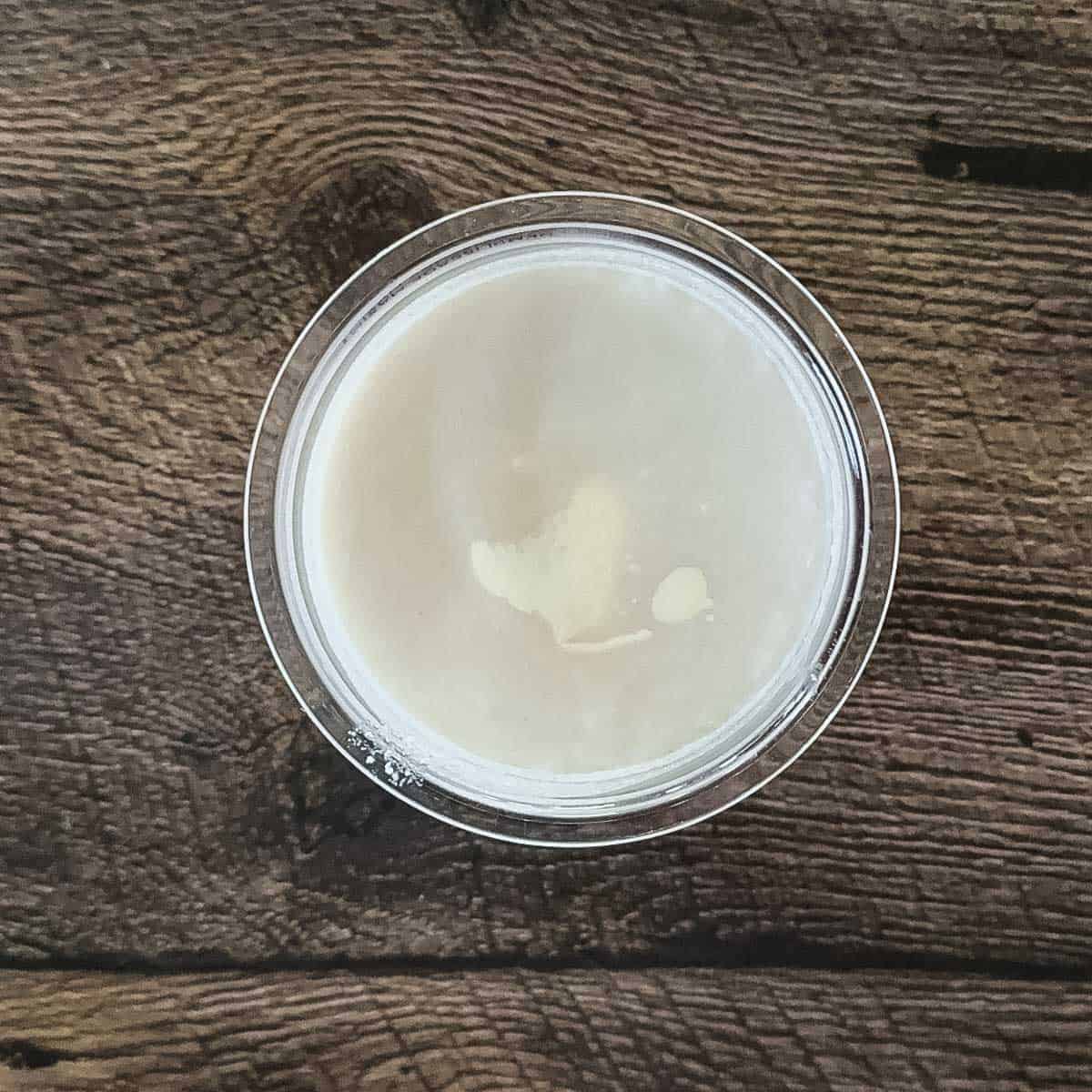 The ingredients for the ice cream in a pint container.