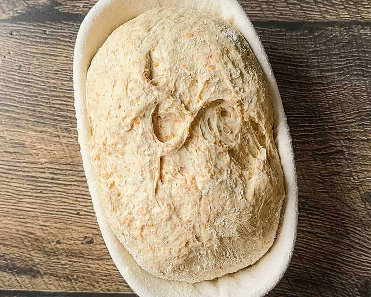 The dough in the banneton basket after it has doubled in size.