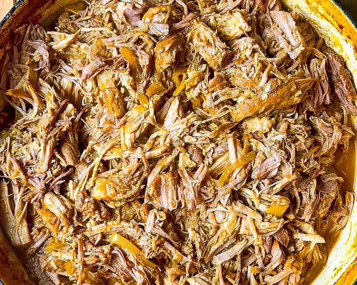 Pulled pork shredded and mixed with cooking juices.