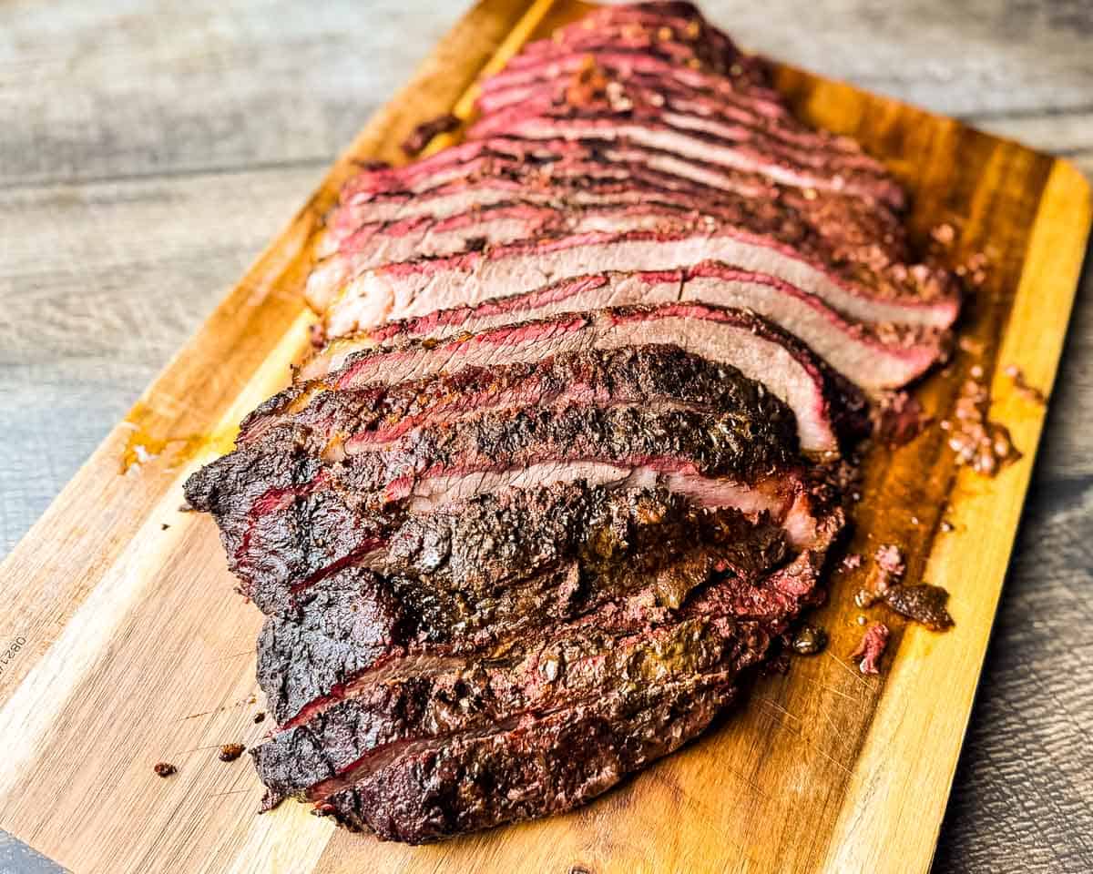 Close-up of juicy brisket slices showing a pink smoke ring and tender interior.