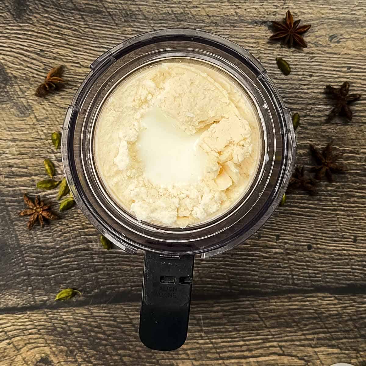 Adding milk to crumbly Ninja Creami chai ice cream after first spin before using RE-SPIN function.