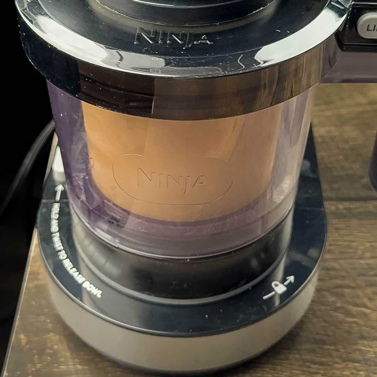 The ice cream processing in the Ninja Creami machine.