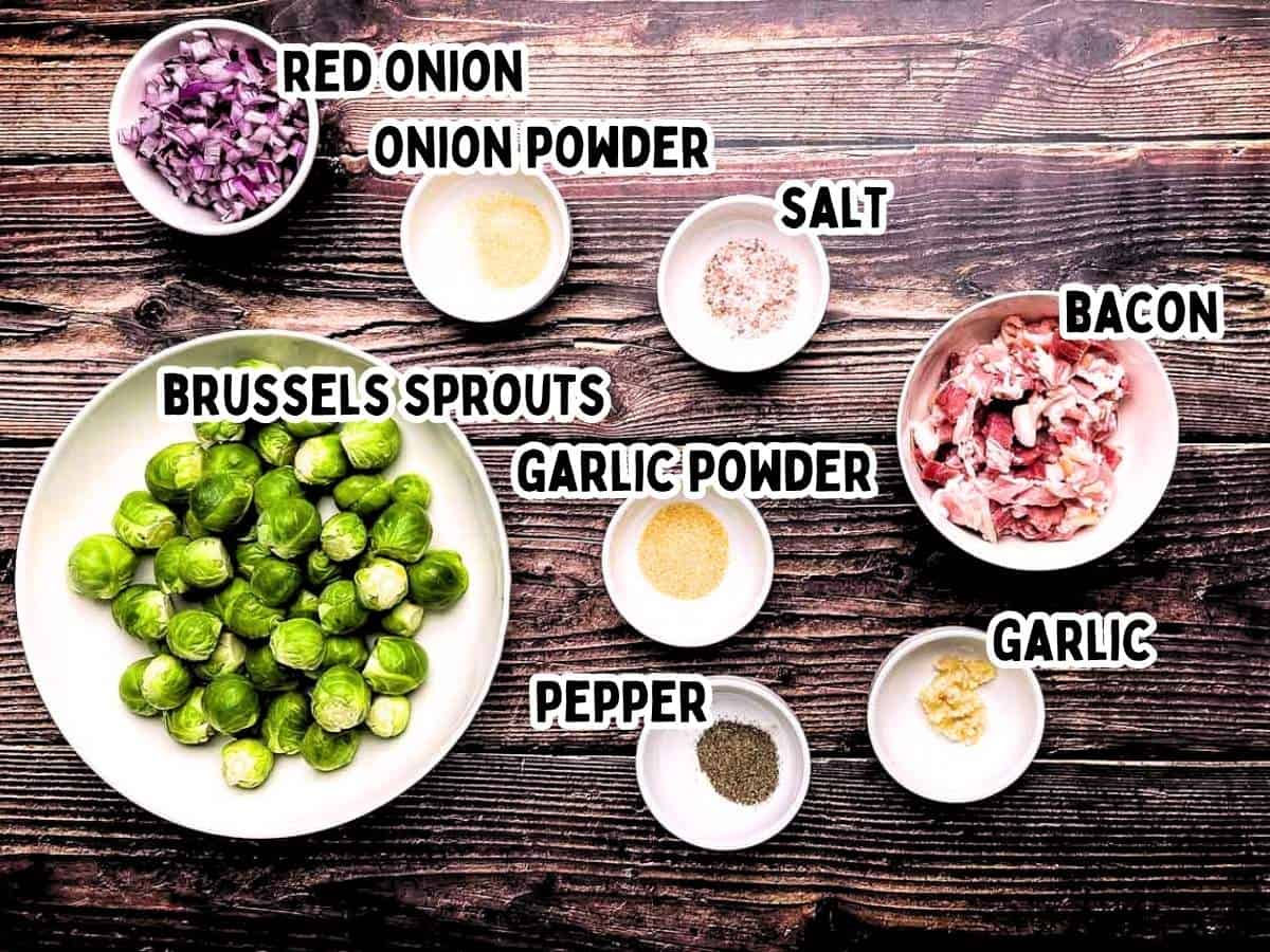 Labeled ingredients for smoked Brussels sprouts on a wooden table.