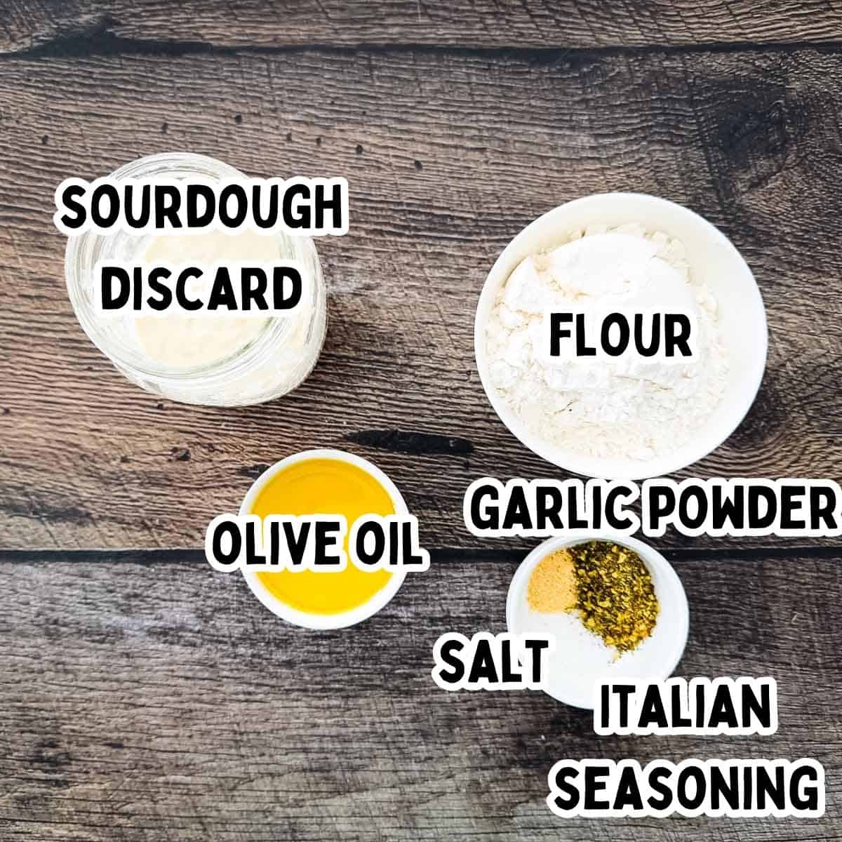 Labeled ingredients for sourdough discard crackers on a wooden table.