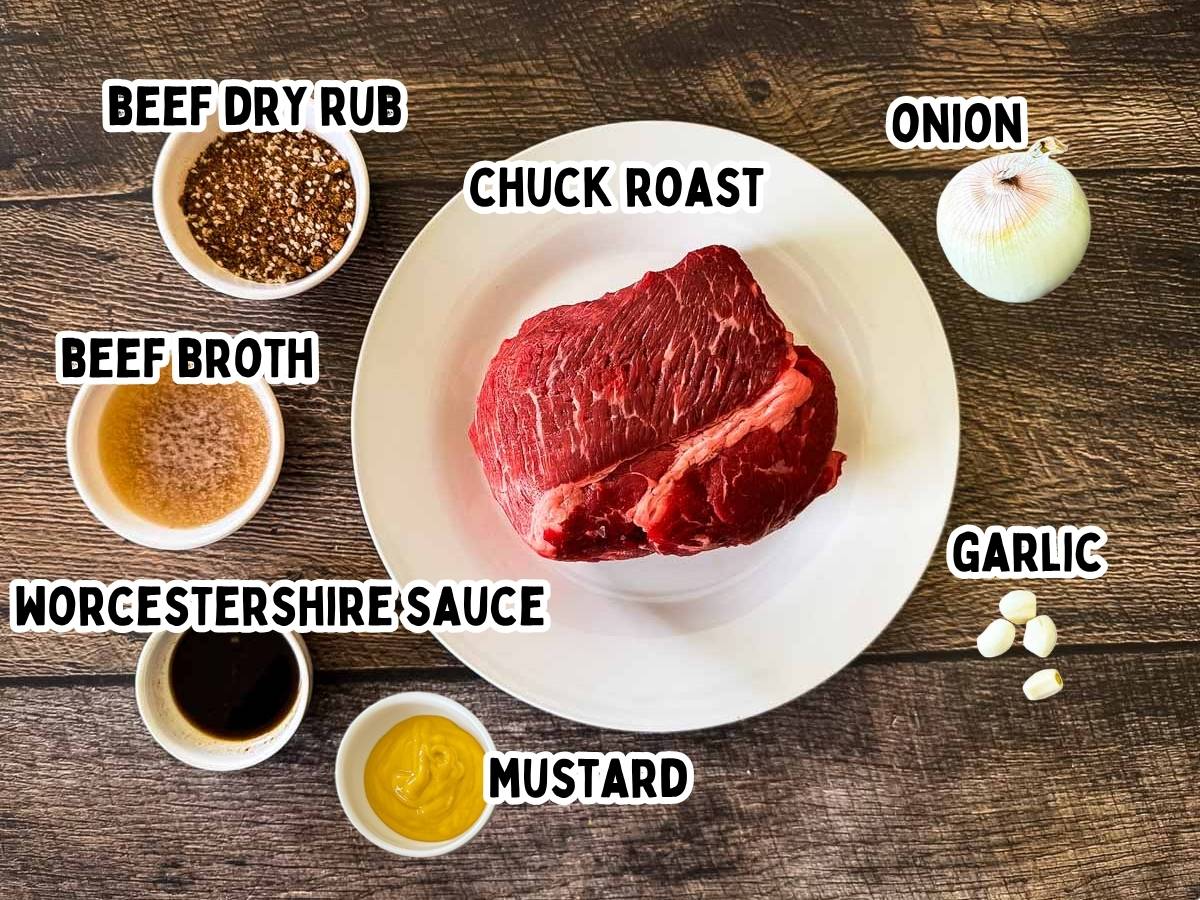Labeled ingredients for smoked pulled beef on a rustic wooden table.