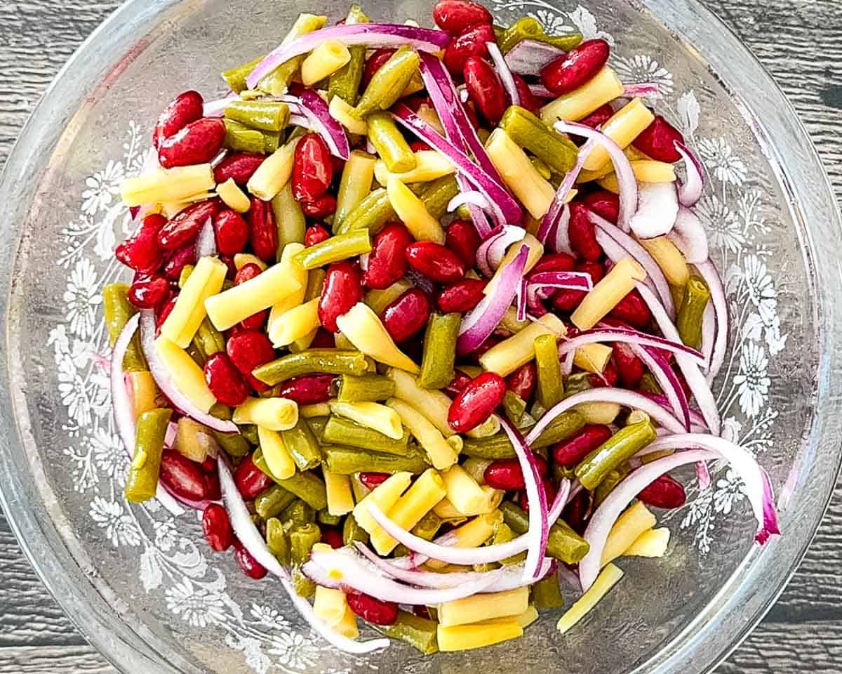 The chilled bean salad in a glass bowl, ready to serve.