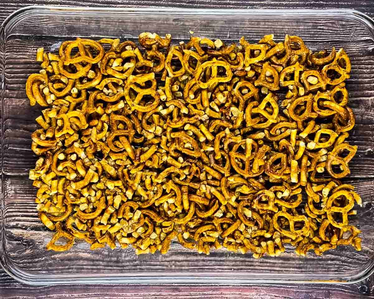 Pretzel crust mixture pressed into a 9x13 baking dish before baking.