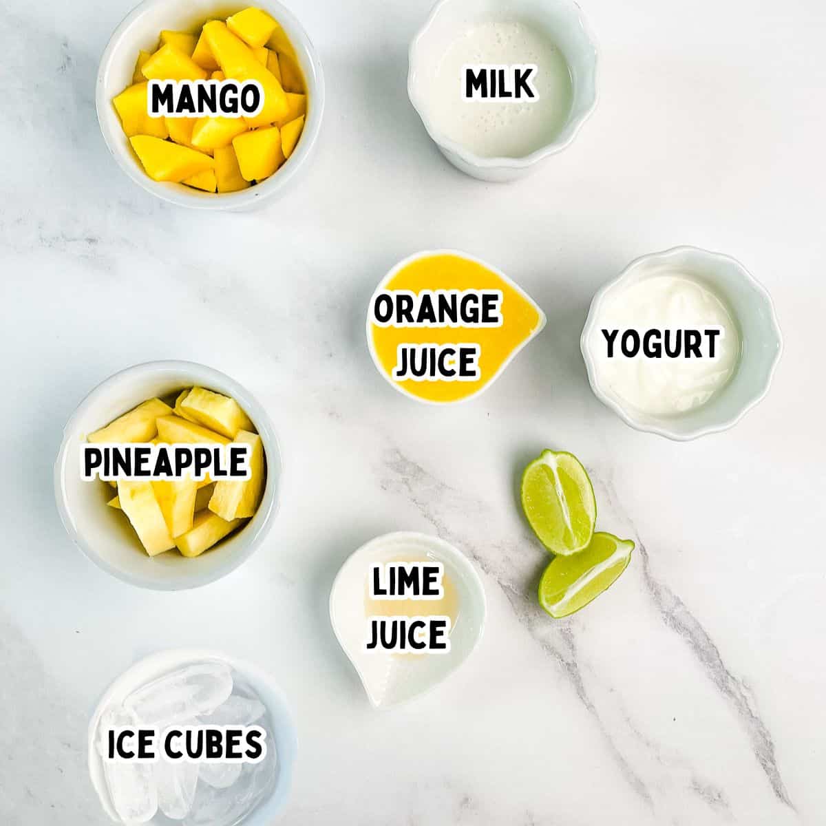 The labeled ingredients for the mango pineapple smoothie.
