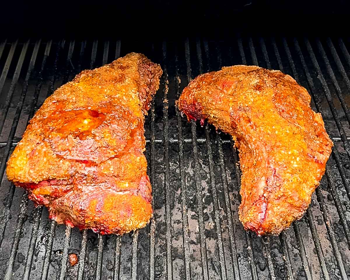Tri-tip roasts with a well-developed bark after smoking, ready to be wrapped with beef broth and tallow.