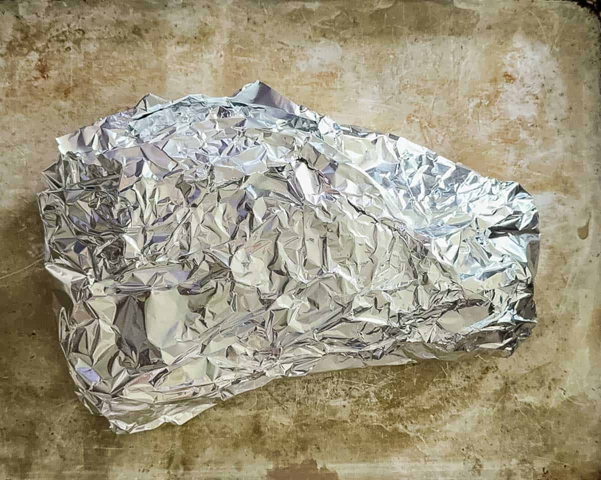 The wrapped roast after it was removed from the pellet grill and before it was placed in a cooler.