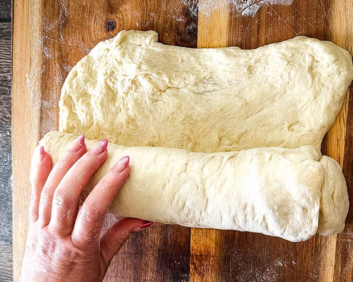 Rolling the dough into a log for the second rise.
