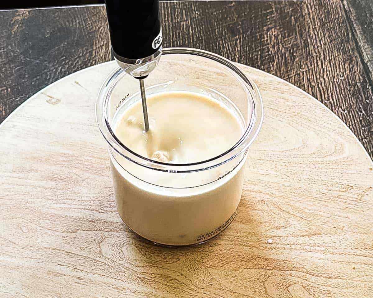 Butter pecan ice cream base mixed in a pint container before freezing.