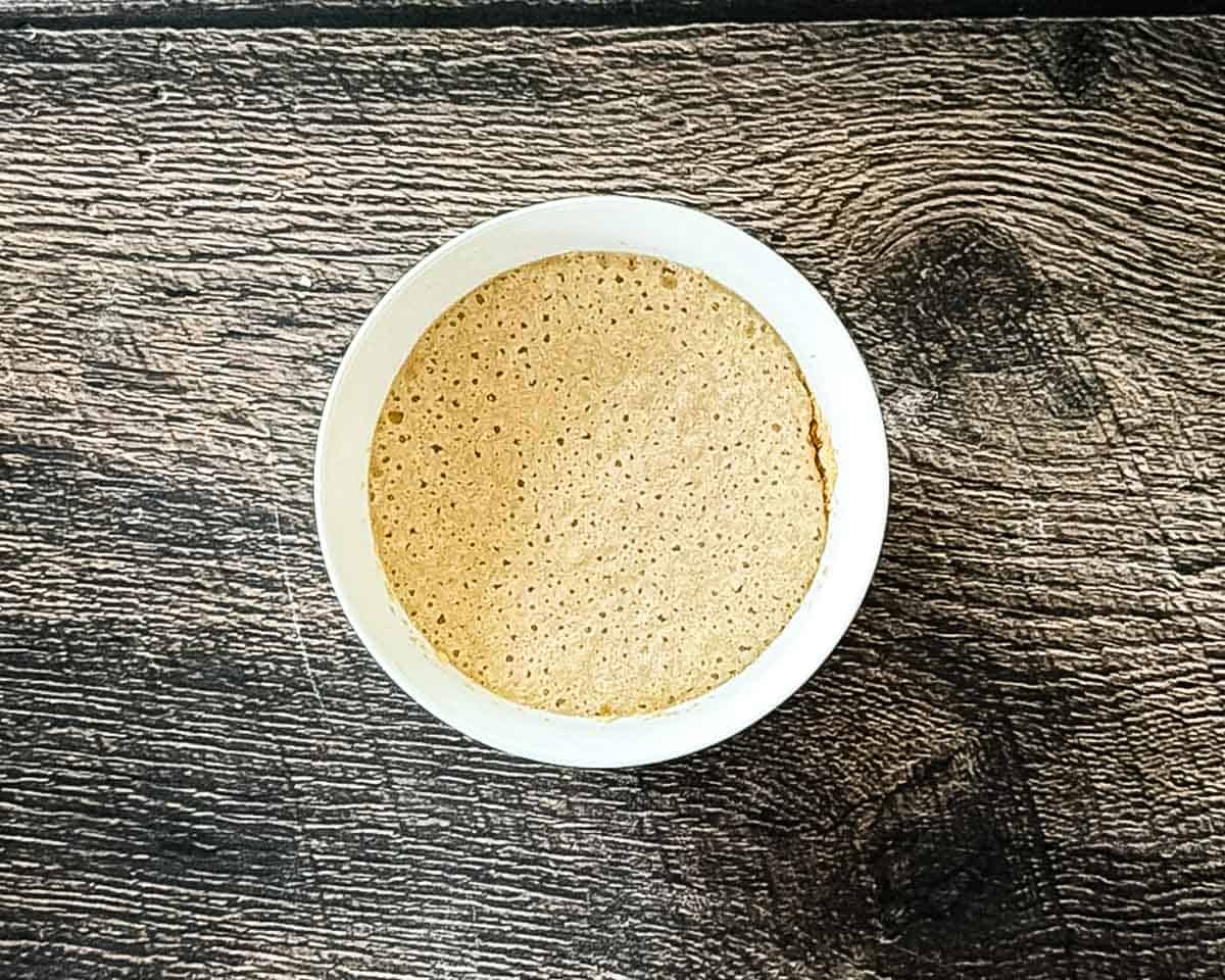 Foamy activated yeast after resting in warm water.