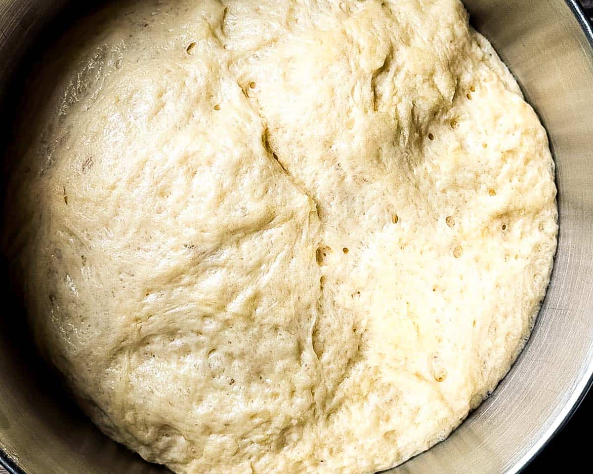 Cinnamon bun dough doubled in size in mixing bowl.