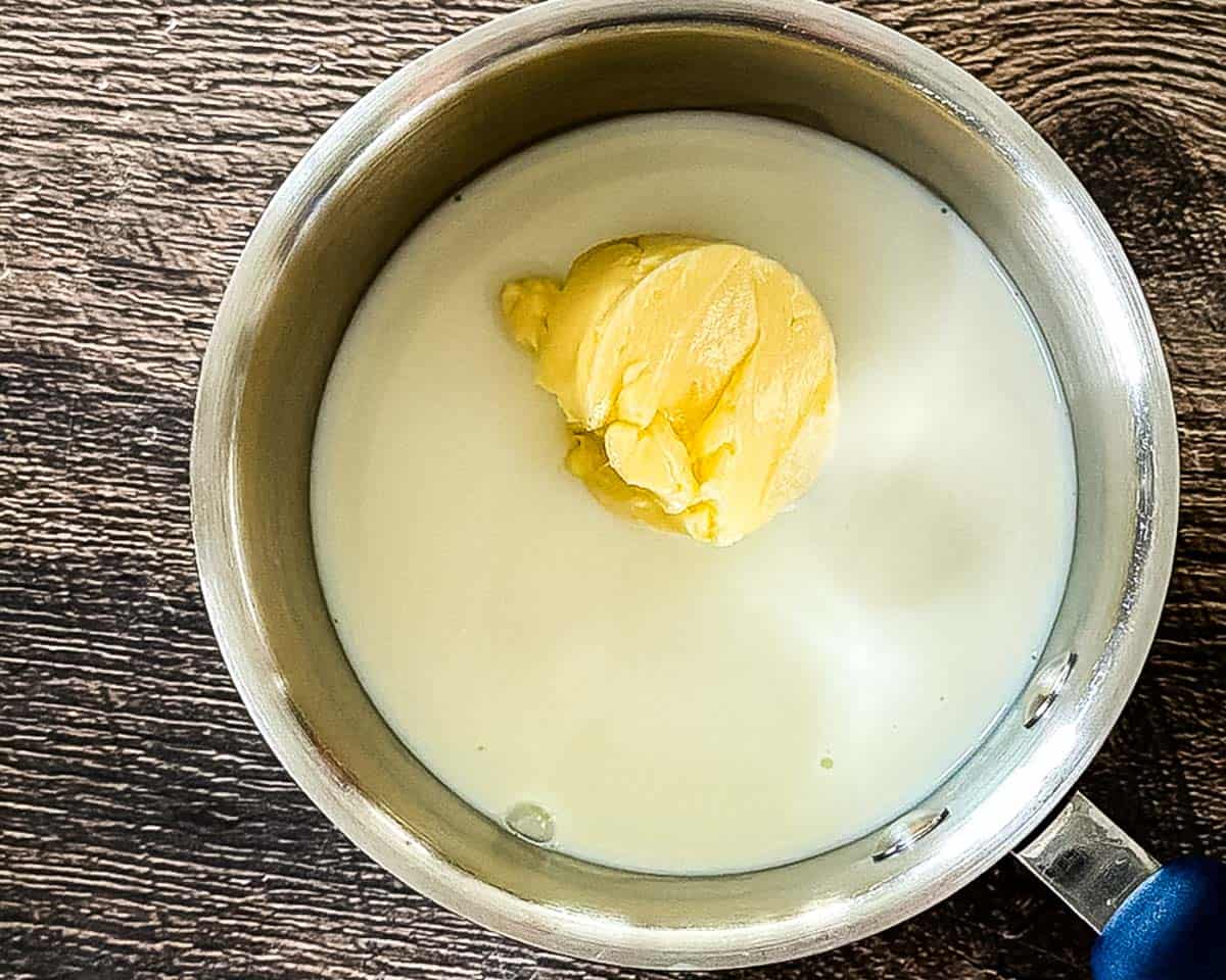 Milk and butter in a saucepan for cinnamon bun dough.