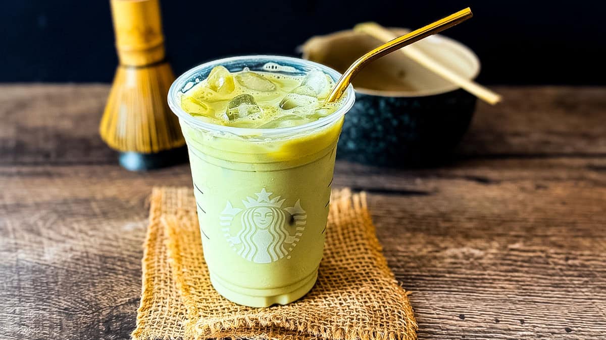 Starbucks copycat iced matcha latte with milk and matcha served over ice.