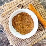 Homemade pumpkin pie spice ready to use in a small white bowl.
