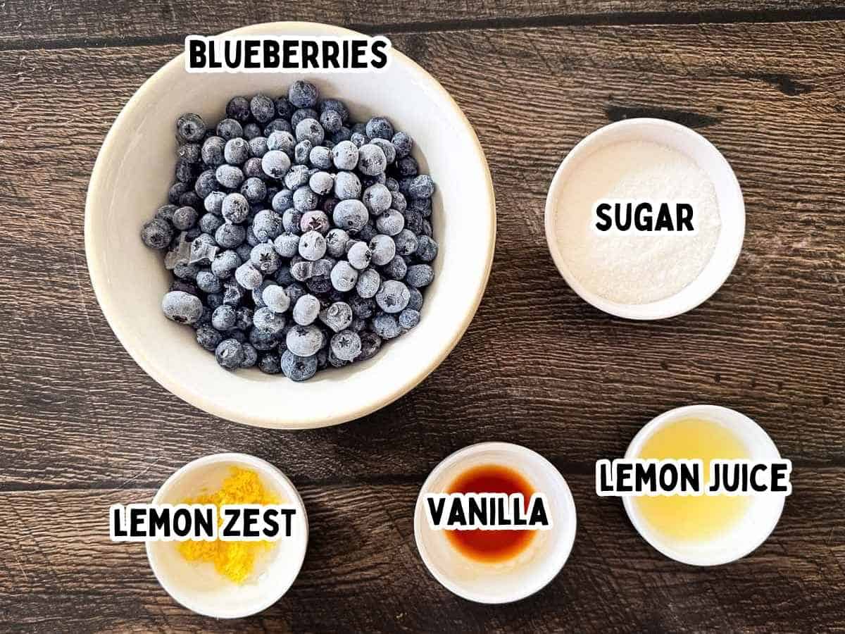 Labeled ingredients for blueberry compote including blueberries, sugar, lemon juice, lemon zest, and vanilla extract.